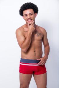curly haired man in boxer briefs