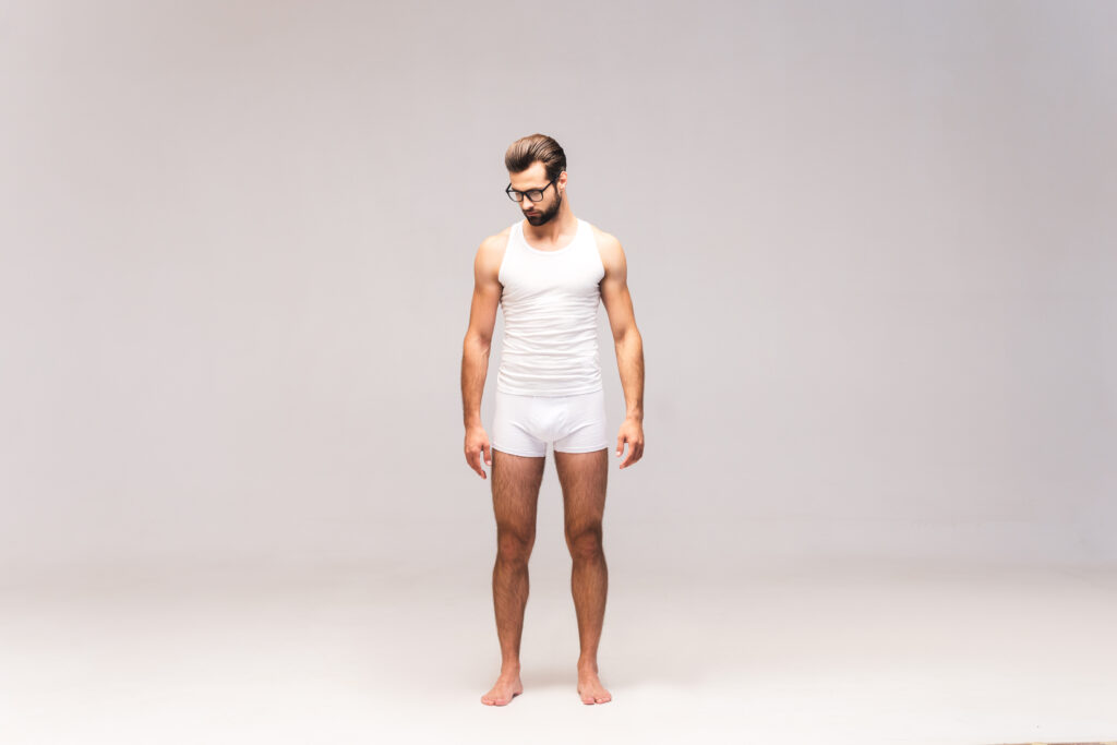 Man in underwear Full length studio shot of handsome young man in underwear